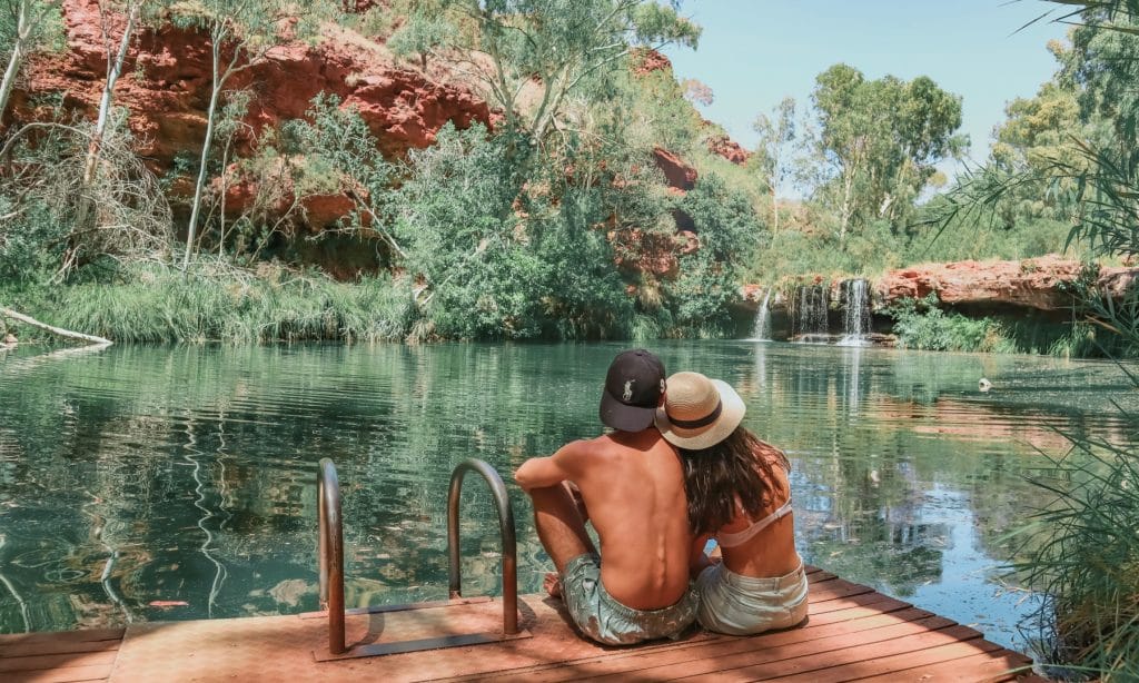People sitting on the side of Fern Pool 